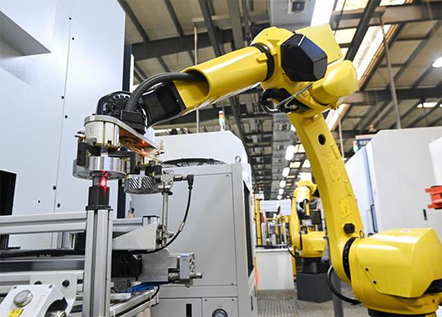 Industrial robot arm in a factory